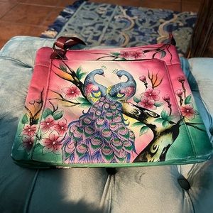 Anushka hand painted all leather cross body purse.